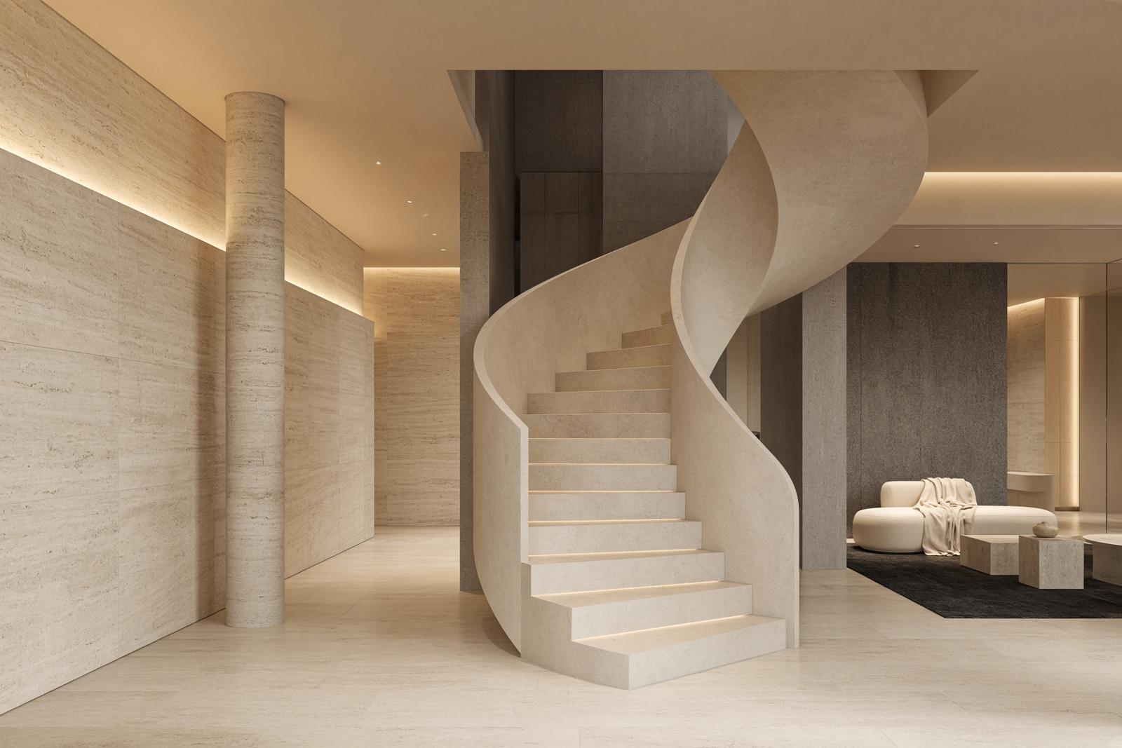 A pale limestone interior with a sculptural stair and warm gold light